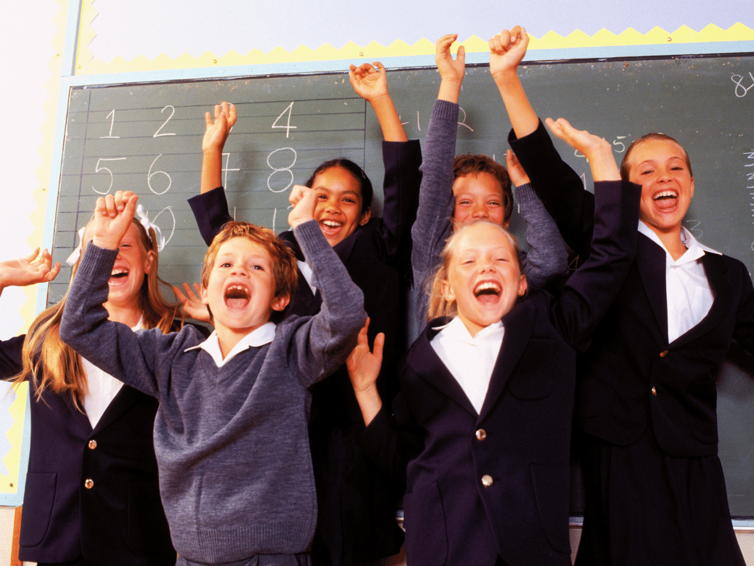 Learners cheering and being happy in class.