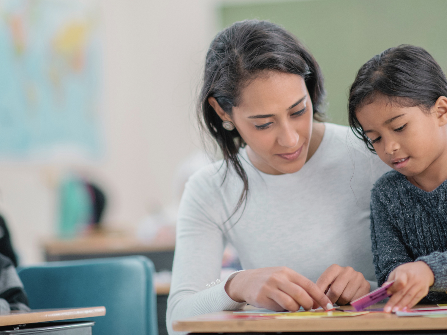 A teacher and a student learning grammar in KS1 and KS2