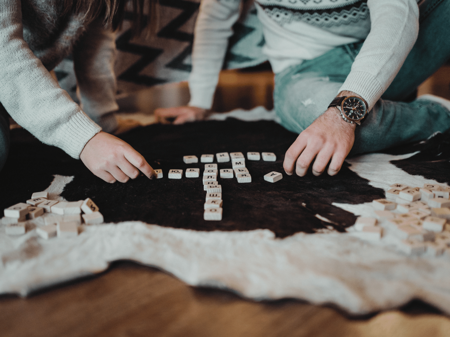 Two people playing a vocabulary game to improve their literacy.