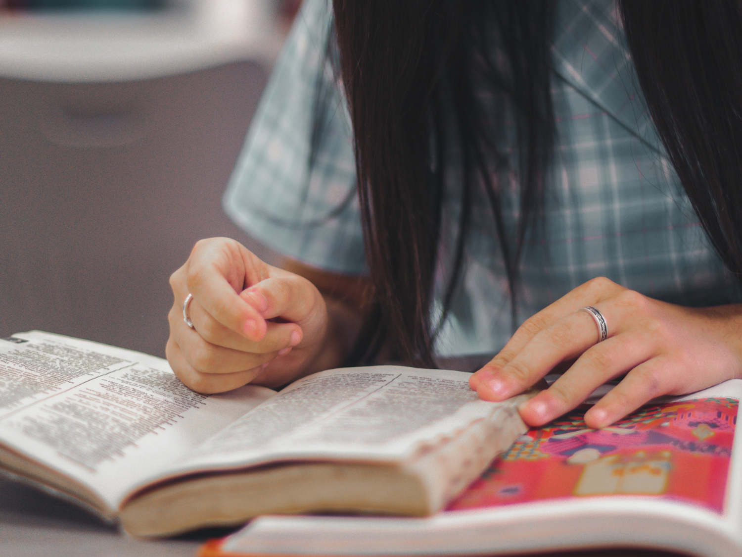 Student reading in a classroom