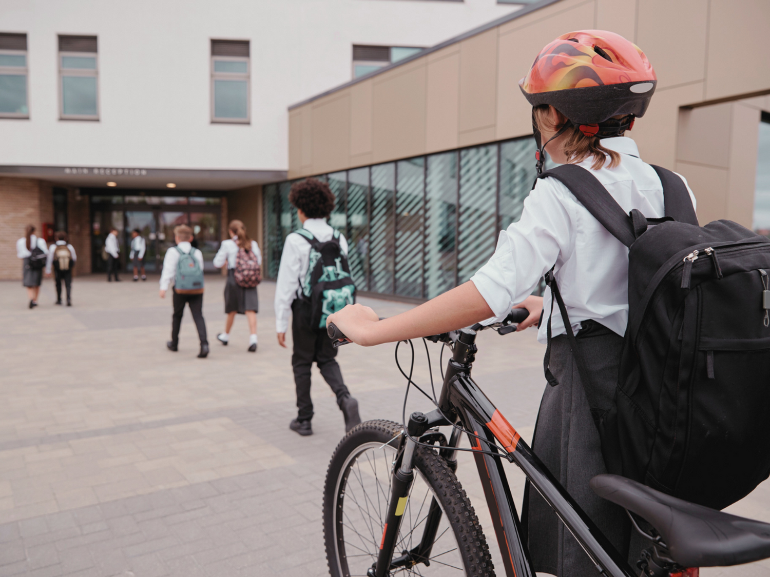 Learners going to school after summer.