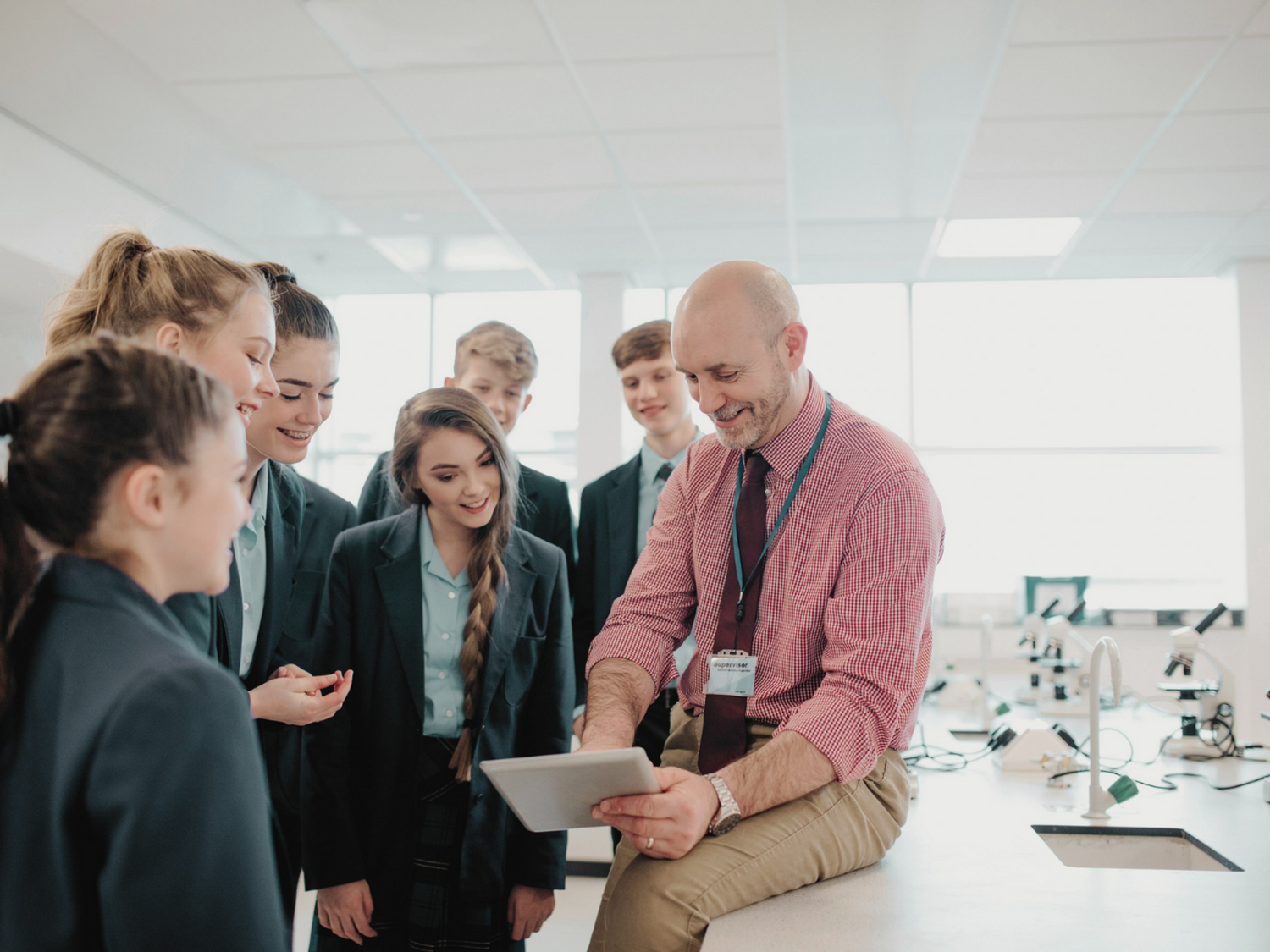 A teacher reading with a class of students